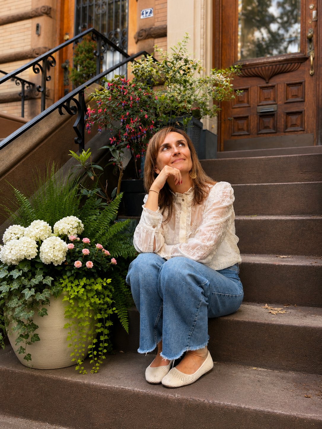 Zory Matarelli on a brownstone stoop in New York